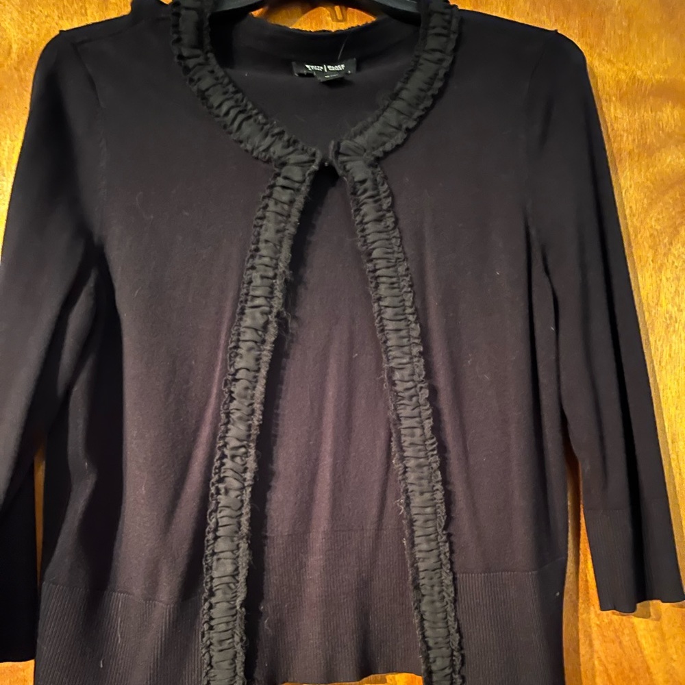 Black ruffled dress sweater.